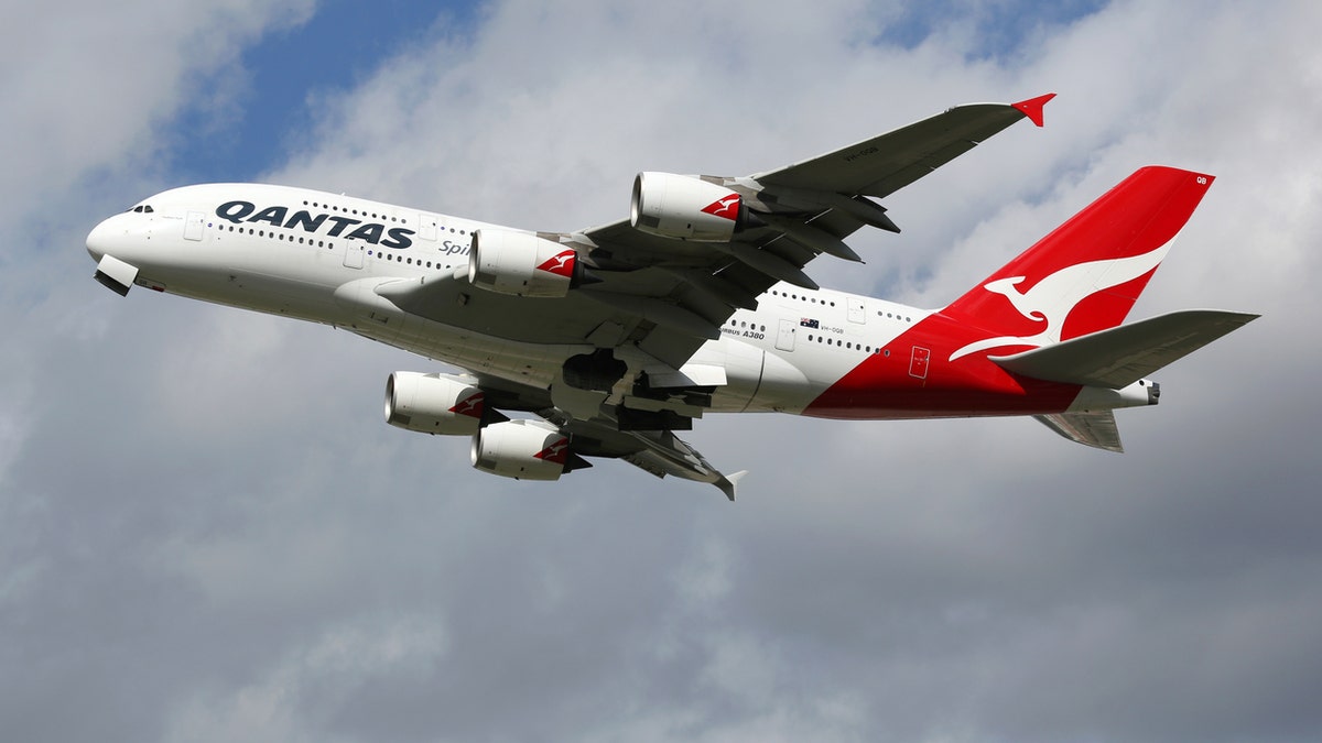 London Heathrow, United Kingdom - August 28, 2015: A Qantas Airways Airbus A380 with the registration VH-OQB taking off from London Heathrow Airport (LHR) in the United Kingdom. The Airbus A380 is the world's largest passenger airliner. Qantas is the flag carrier airline of Australia.