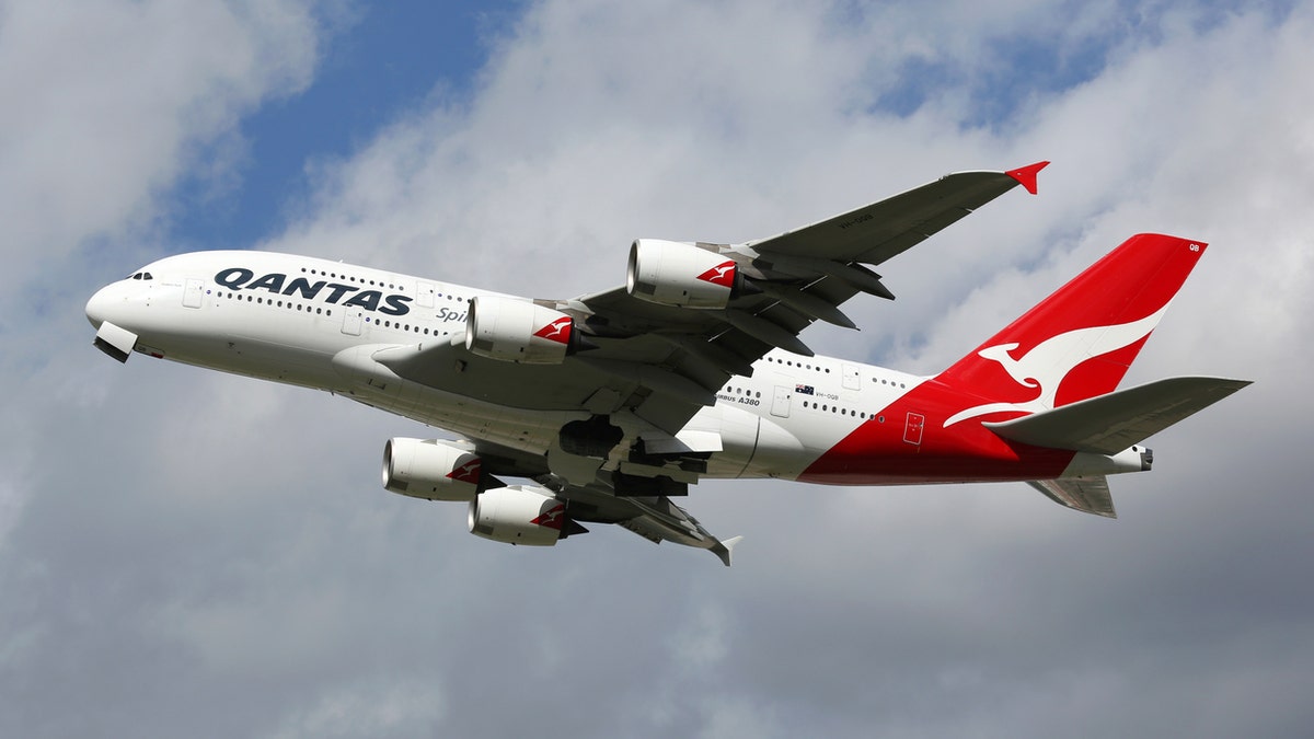 London Heathrow, United Kingdom - August 28, 2015: A Qantas Airways Airbus A380 with the registration VH-OQB taking off from London Heathrow Airport (LHR) in the United Kingdom. The Airbus A380 is the world's largest passenger airliner. Qantas is the flag carrier airline of Australia.