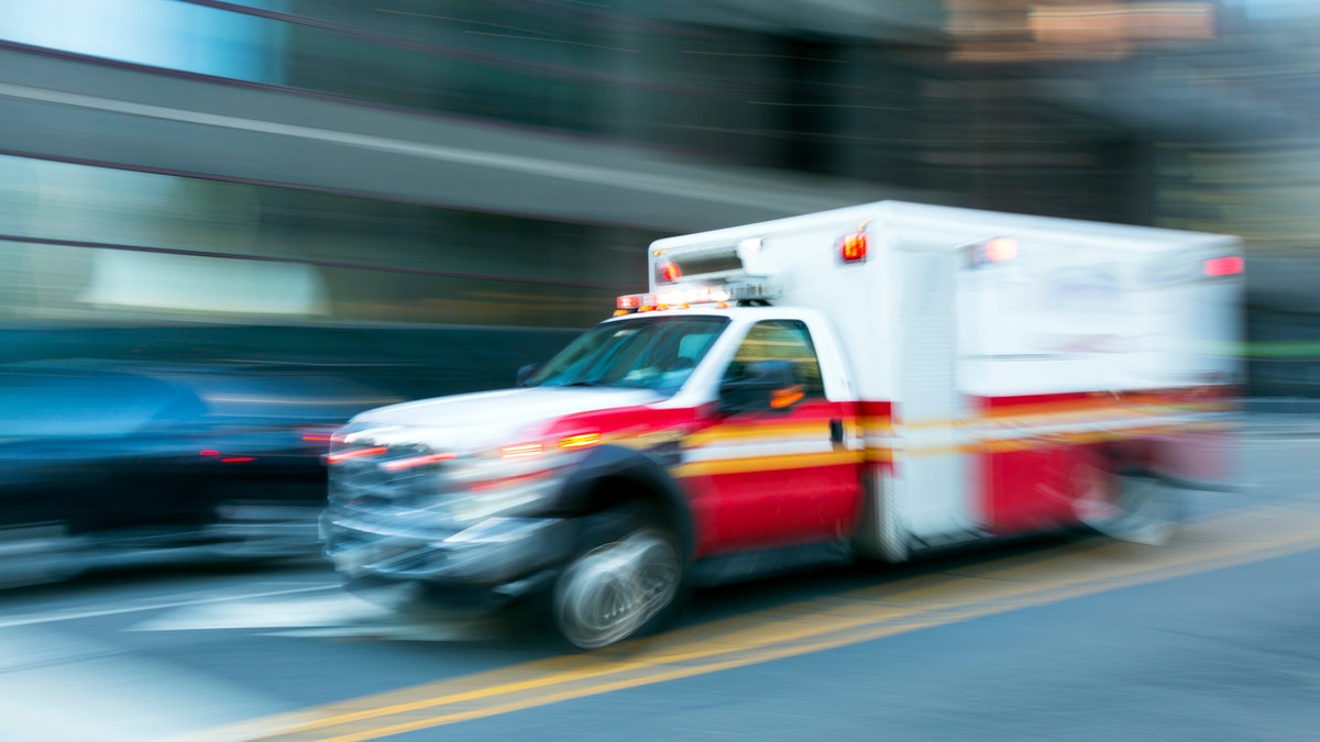 ambulance speeding in New York City, blurred motion
