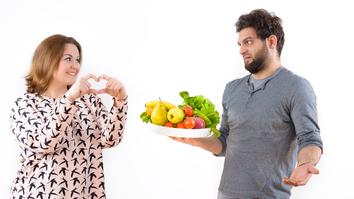 Man holding fruit istock