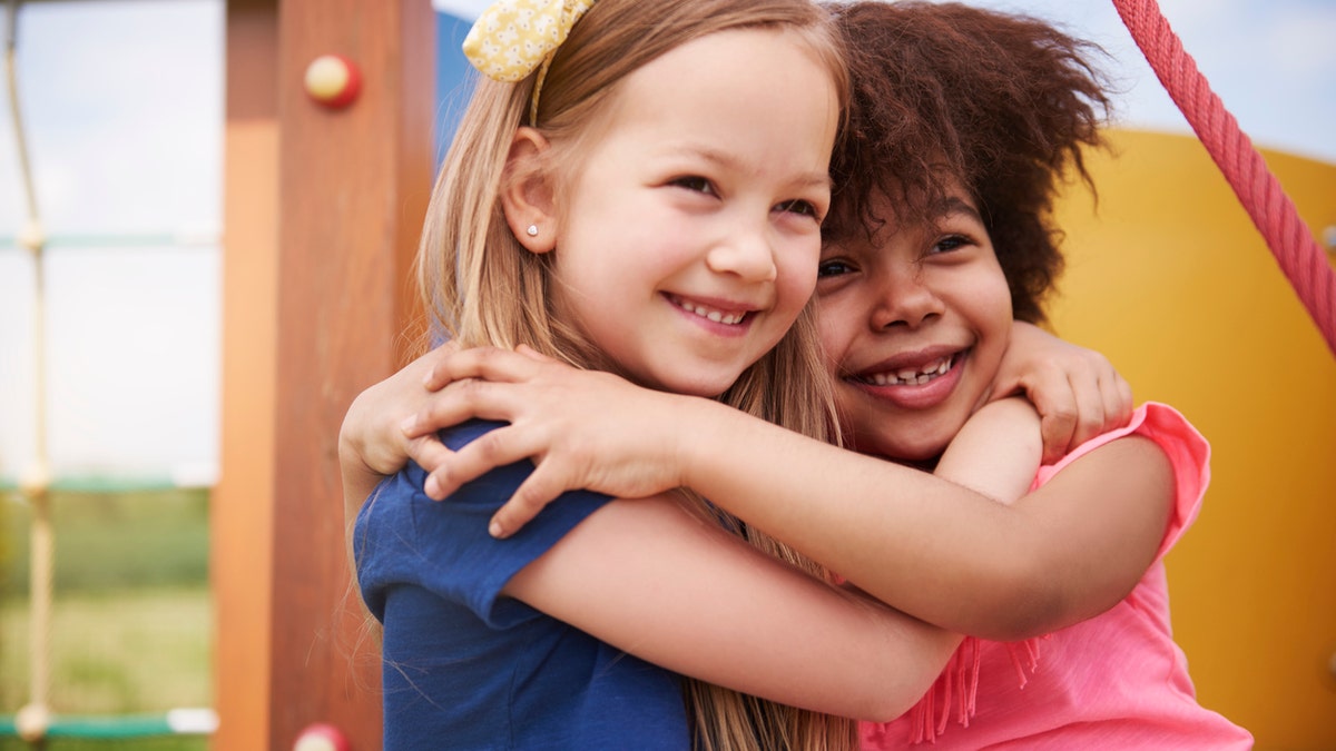 kids hugging istock