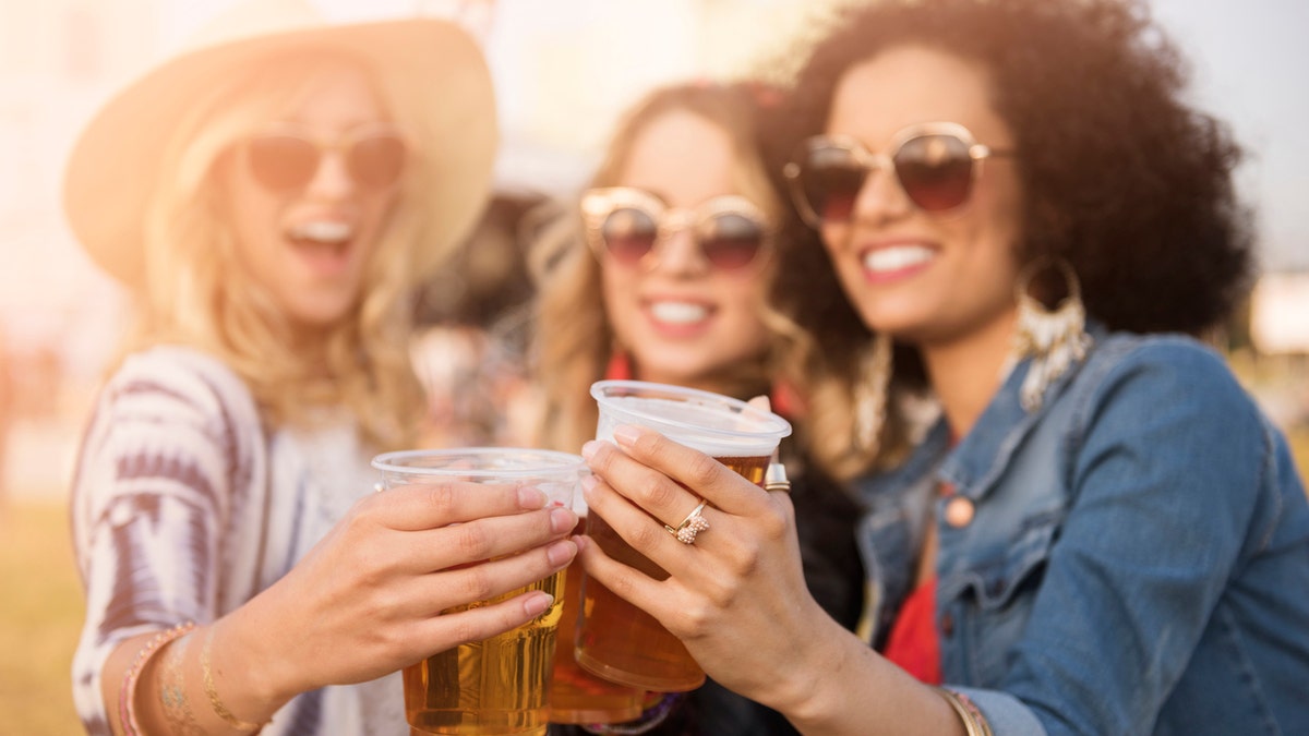 women drinking beer istock