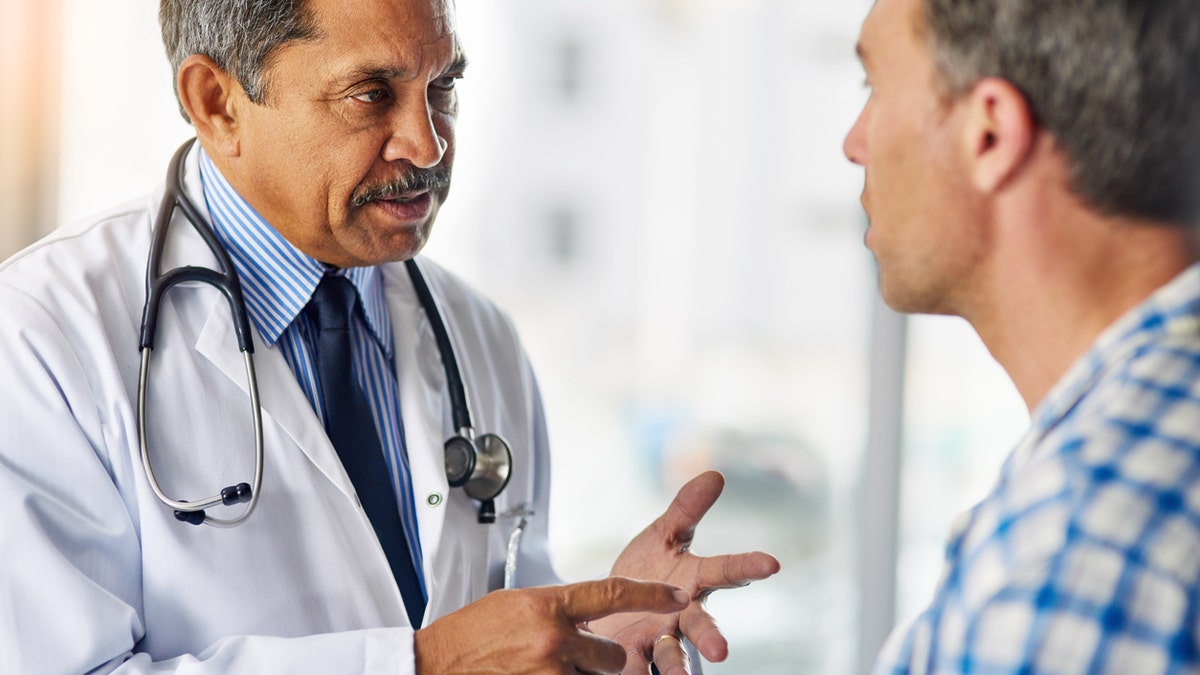 Cropped shot of a doctor a giving his patient advice during a consult