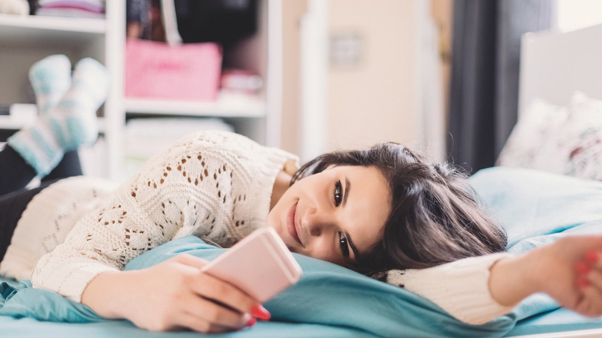 9bb63834-Woman on phone istock