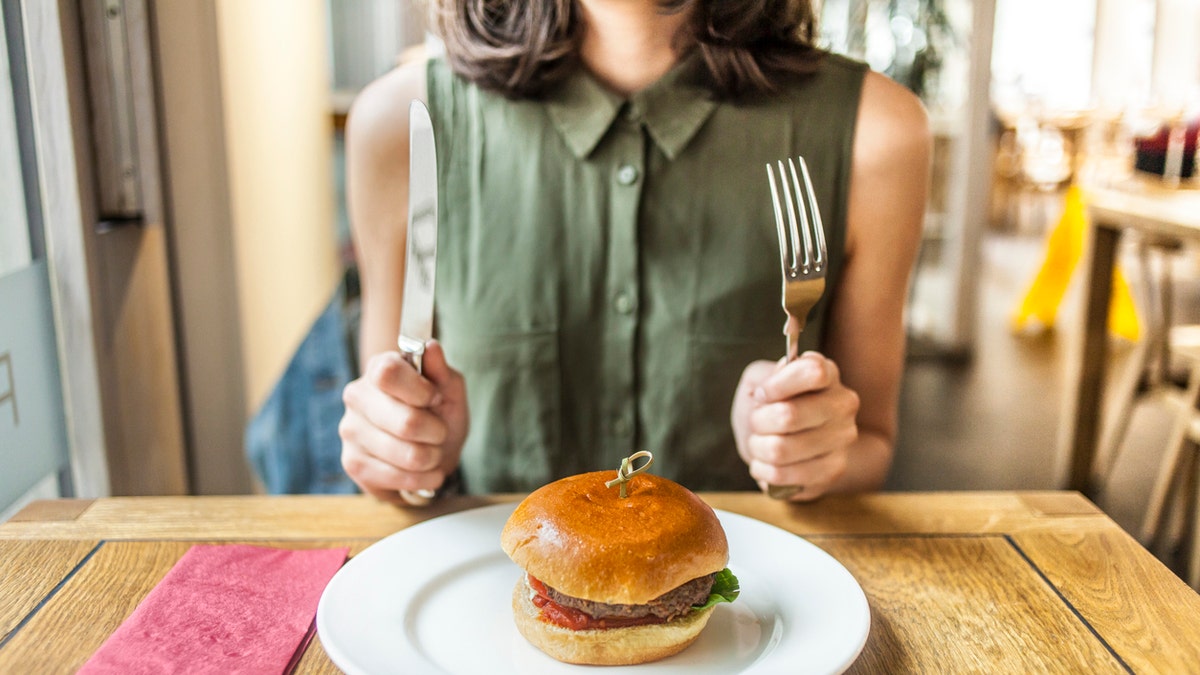 woman hamburger istock