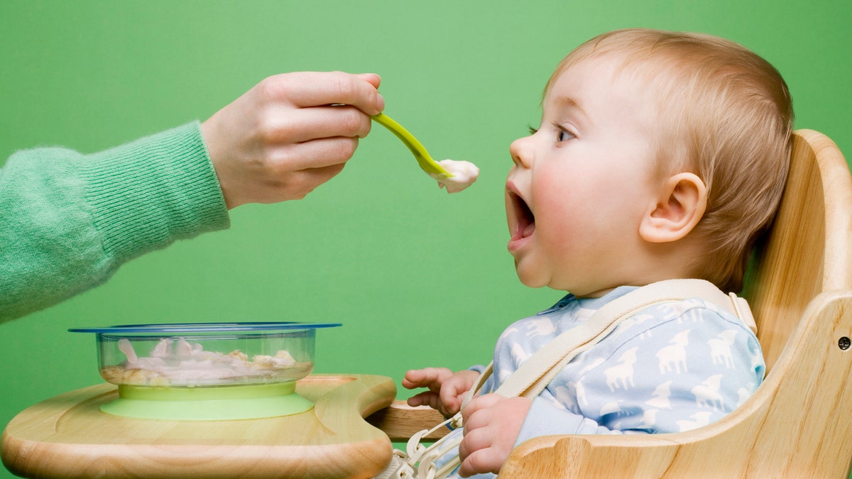 baby eating istock