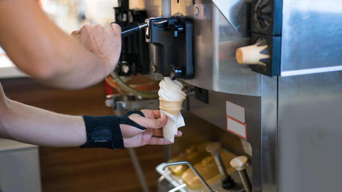 Man serving ice cream at a shop