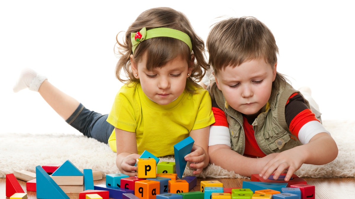children_playing_blocks_istock