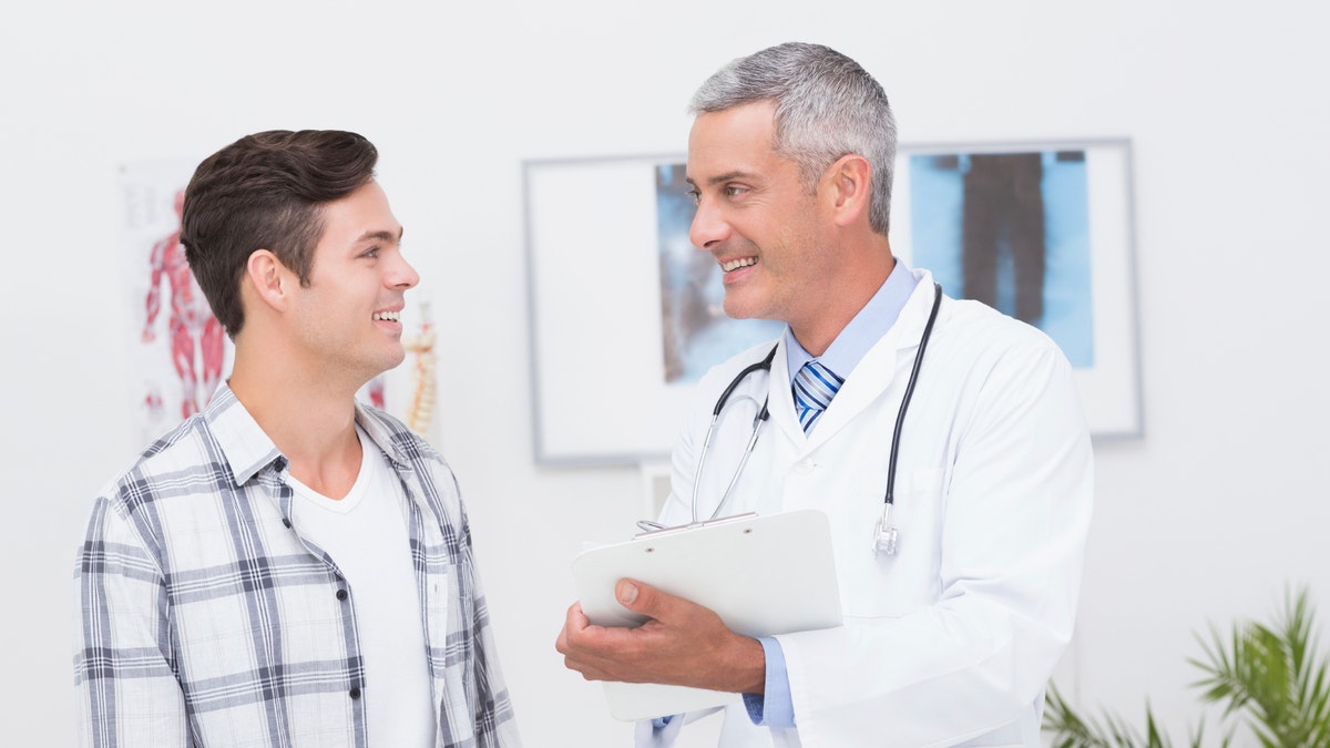 doctor_male_patient_smiling_istock