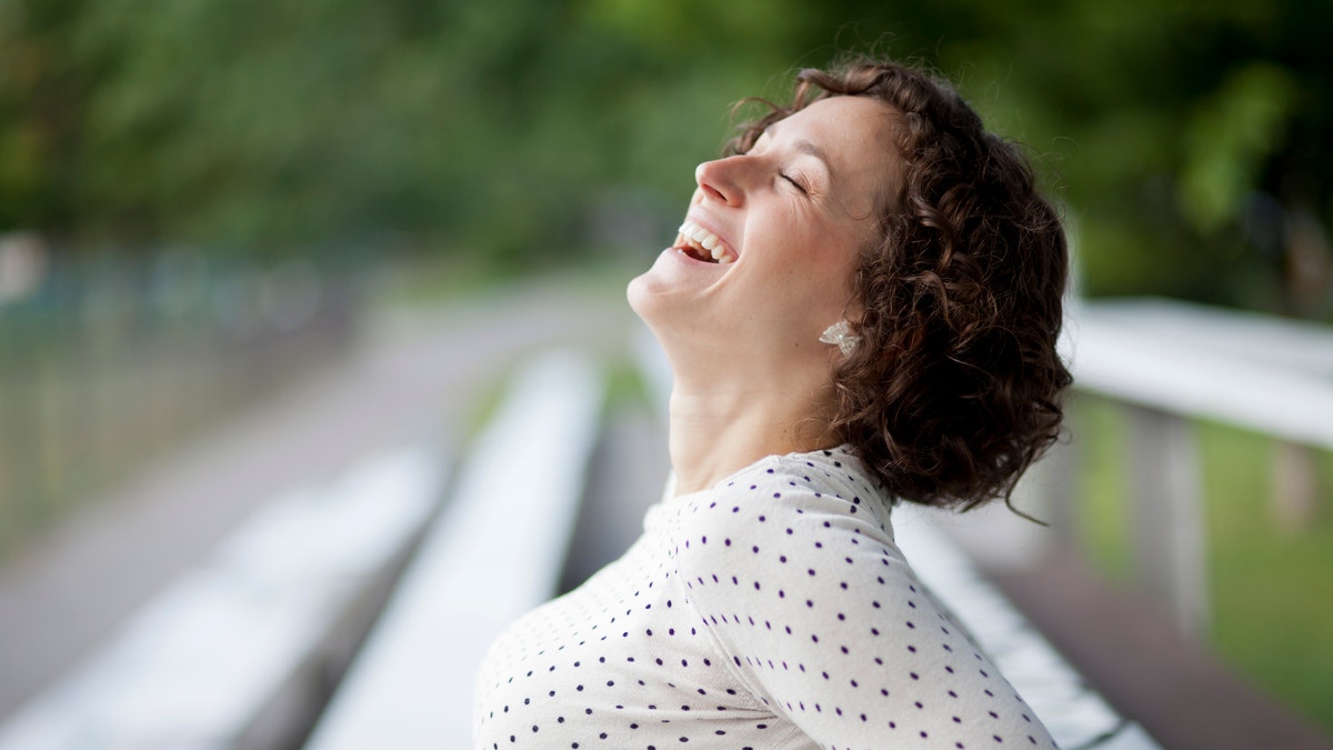 happy_woman_laughing_istock