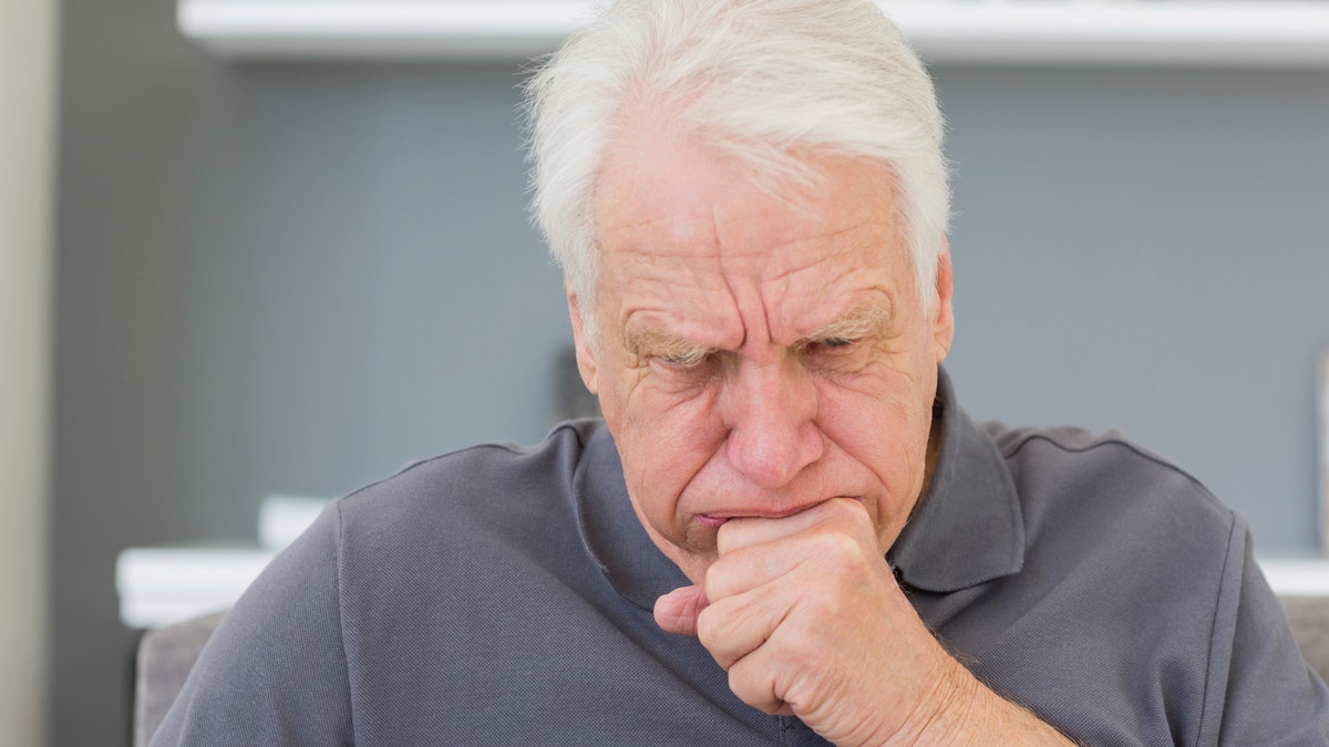 man_coughing_istock