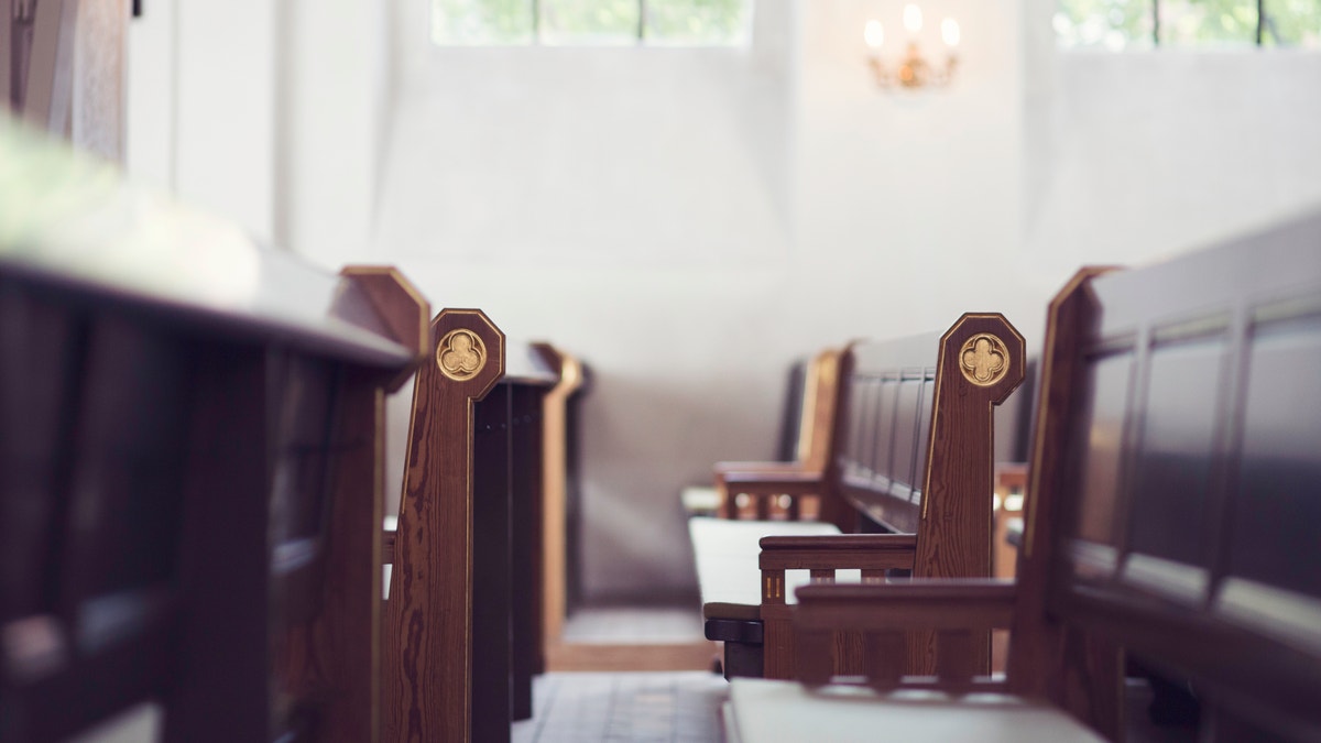 Two rows of benches in a church