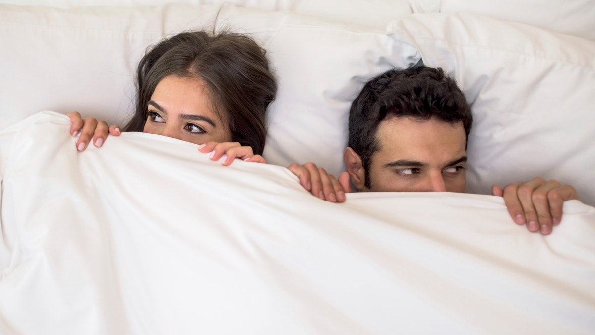 scared_couple_bed_istock