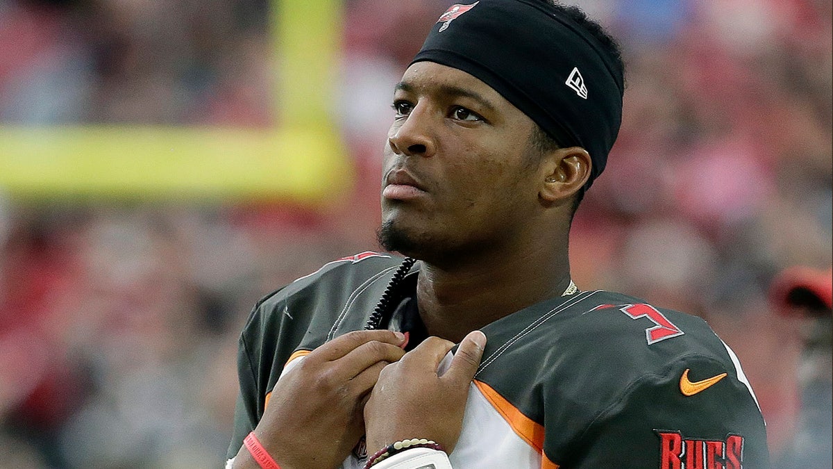 FILE - In this Sunday, Oct. 15, 2017, file photo, Tampa Bay Buccaneers quarterback Jameis Winston stands on the sidelines during the second half of an NFL football game against the Arizona Cardinals in Glendale, Ariz. Winston is being investigated for allegedly groping a female Uber driver in 2016. The Buccaneers quarterback has denied the charge on his Twitter and Instagram accounts. (AP Photo/Rick Scuteri, File)