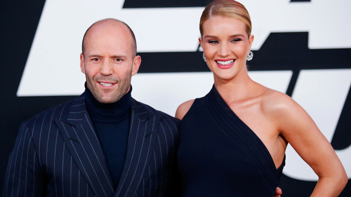 Actor Jason Statham and model Rosie Huntington-Whiteley attend 'The Fate Of The Furious' New York premiere at Radio City Music Hall in New York, U.S. April 8, 2017. REUTERS/Eduardo Munoz - RC16EDDFAAA0