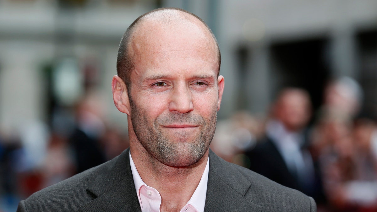 Actor Jason Statham poses for photographers as he arrives for the world premiere of 