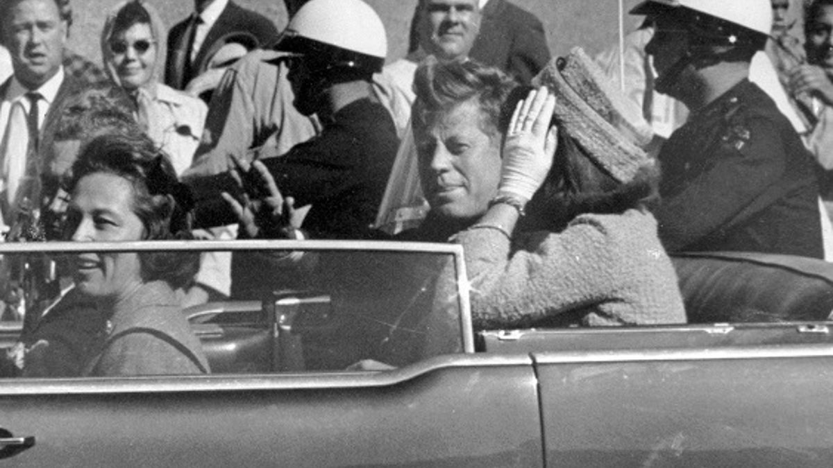 FILE - In this Nov. 22, 1963 file photo, President John F. Kennedy waves from his car in a motorcade in Dallas. Riding with Kennedy are First Lady Jacqueline Kennedy, right, Nellie Connally, second from left, and her husband, Texas Gov. John Connally, far left. President Donald Trump, on Saturday, Oct. 21, 2017, says he plans to release thousands of never-seen government documents related to President John F. Kennedy's assassination. (AP Photo/Jim Altgens, File)