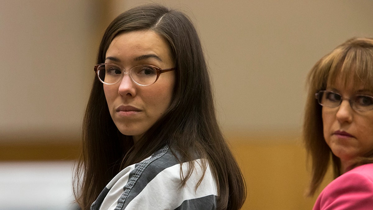 Jodi Arias (L) and her attorney Jennifer Willmott (R) look back during sentencing hearing in Maricopa County Superior Courtroom in Phoenix, Arizona April 13, 2015. An Arizona judge sentenced former waitress Jodi Arias to life in prison with no possibility of parole on Monday for shooting and stabbing her ex-boyfriend to death in 2008. REUTERS/Mark Henle/The Arizona Republic/Pool - TM3EB4D147B01