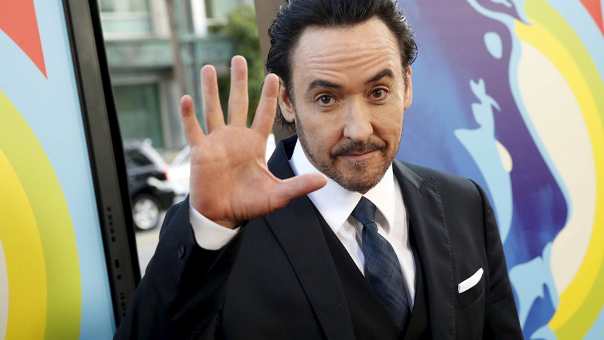 Actor John Cusack arrives at the premiere of the movie 