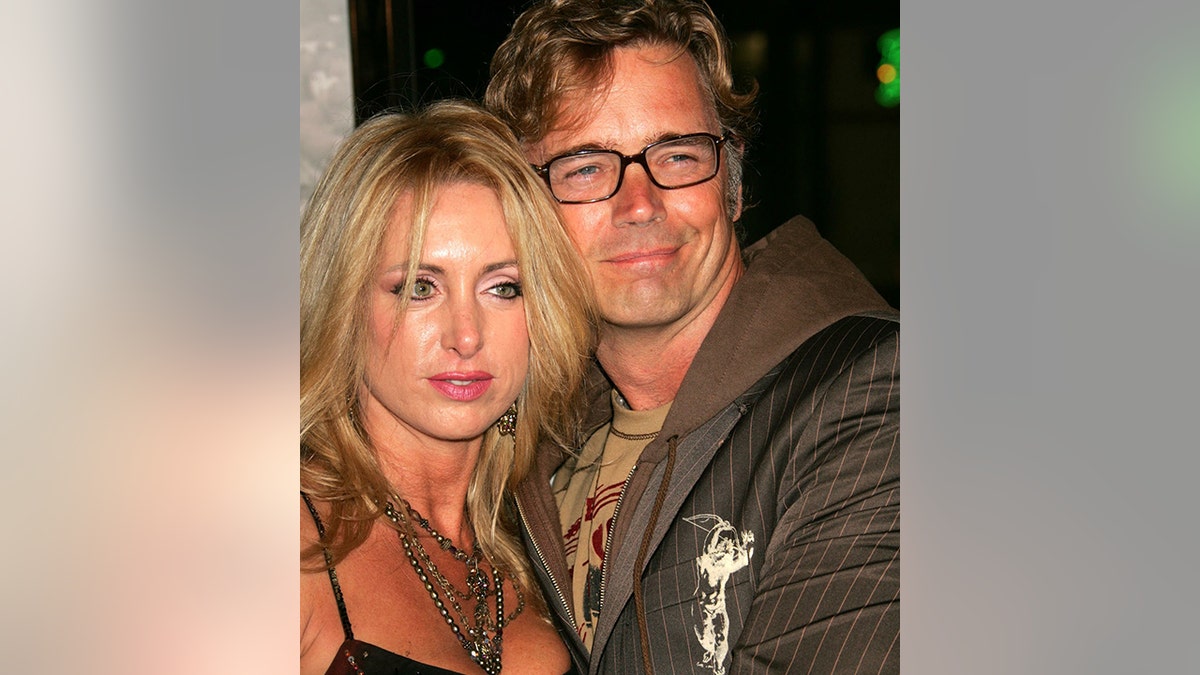 John Schneider and wife Elly Castle at the premiere for North Country at Grauman's Chinese Theaterin Hollywood, California in 2005.