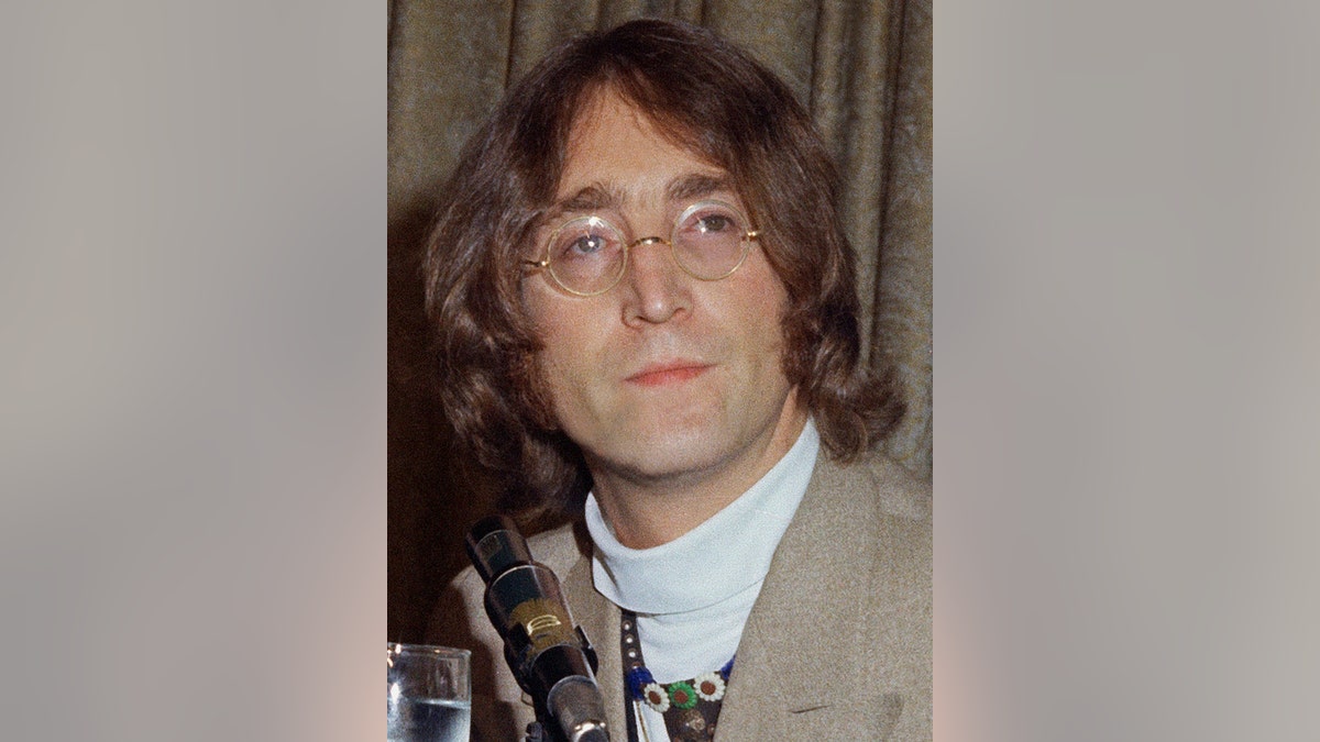 FILE - This 1971 file photo shows former Beatles singer and guitarist John Lennon at an unknown location. The draft of a two-page typed letter with handwritten annotations from John Lennon to Paul and Linda McCartney, thought to have been written in 1971 shortly after the Beatles' breakup, was sold by RR Auction, of Boston, Friday, Nov. 18, 2016, for nearly $30,000. (AP Photo, File)