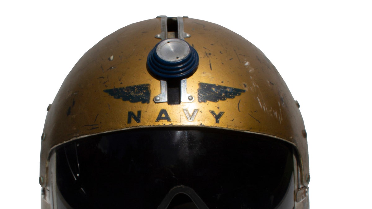 That's not just any astronaut on Navy's helmet, that's Navy royalty