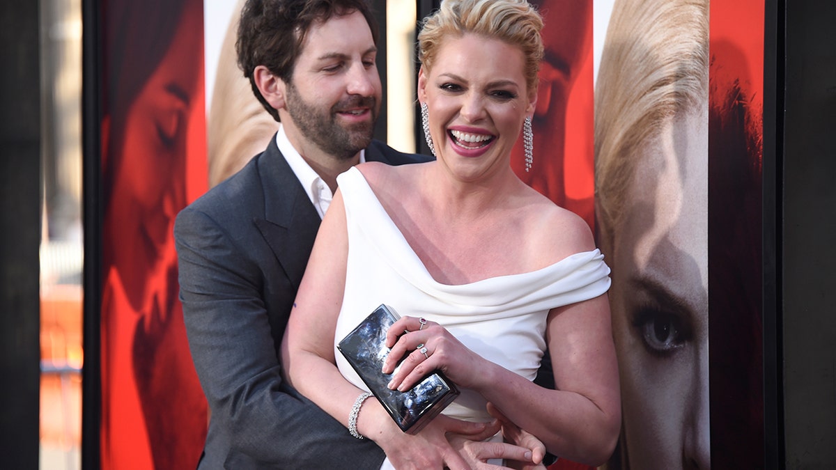 Cast member Katherine Heigl (R) and Josh Kelley attend the premiere of 