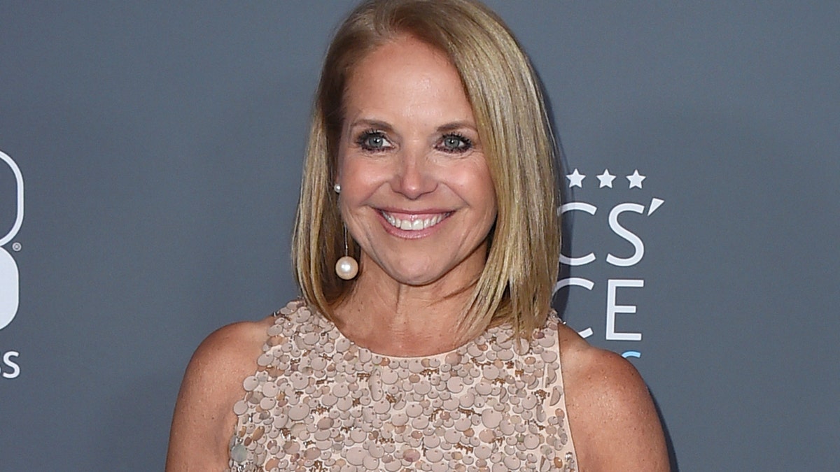 In this Jan. 11, 2018 file photo, Katie Couric poses in the press room at the 23rd annual Critics' Choice Awards in Santa Monica, Calif. NBC is bringing back Katie Couric to co-host the opening ceremony of the Winter Olympics next month. She will be co-host with Mike Tirico, who is replacing Bob Costas as prime-time host of the games. The ceremony will take place in South Korea on Feb. 9.