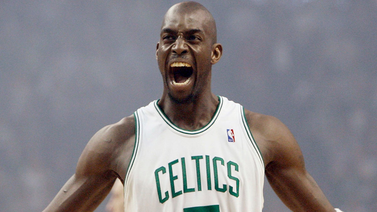 FILE - In this May 6, 2008, file photo, Boston Celtics' Kevin Garnett gestures to the crowd just before tipoff in Game 1 of an NBA Eastern Conference semifinal basketball series against the Cleveland Cavaliers in Boston. Kevin Garnett is suing an accountant and his firm, alleging they helped a wealth manager steal $77 million from the retired NBA star.  (AP Photo/Winslow Townson, File)