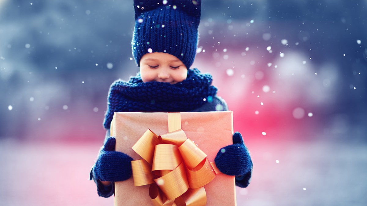child with holiday gift