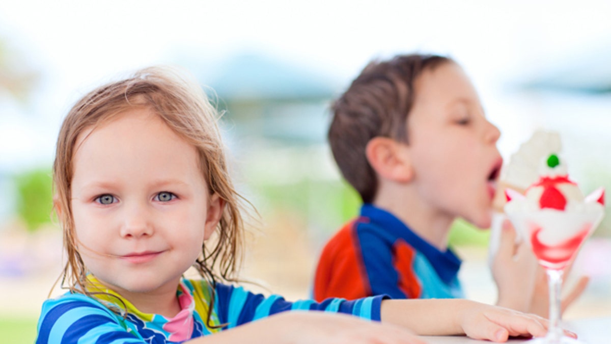Two kids eating ice cream