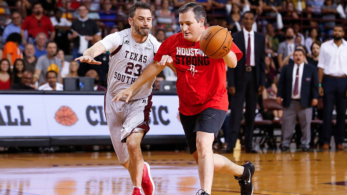 Senator Ted Cruz dribbles past Jimmy Kimmel during the Blobfish Basketball Classic and one-on-one interview at Texas Southern University's Health & Physical Education Arena Saturday, June 16, 2018 in Houston. Cruz challenged Kimmel to the game after Kimmel blamed the Houston Rockets playoff loss on the senator. Cruz won 11-9. (Michael Ciaglo/Houston Chronicle via AP)