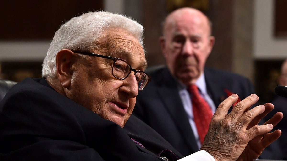 Former Secretary of State Henry Kissinger, left, speaks during the Senate Armed Services Committee hearing on Capitol Hill in Washington, Thursday, Jan. 25, 2018, on global challenges and U.S. national security strategy. Kissinger testified at the hearing along with former Secretary of State George Shultz, right, and former Deputy Secretary of State Richard Armitage. (AP Photo/Susan Walsh)