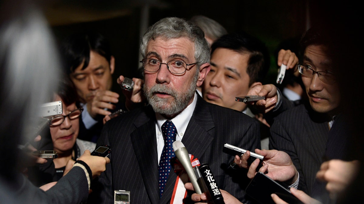 Paul Krugman (C) , Nobel Prize-winning economist and professor emeritus of economics and international affairs at Princeton University, speaks to reporters after a meeting discussing global economy hosted by Japan's Prime Minister Shinzo Abe (not pictured) at Abe's official residence in Tokyo, Japan, March 22, 2016. REUTERS/Franck Robichon/Pool - D1AESTYWYGAA