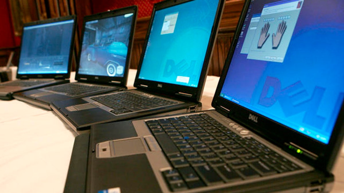 Dell's next generation mobile platforms are shown at a press preview, Tuesday, March 28, 2006, in New York. From left to right are the mobile workstations Dell Precision M90 and Dell Precision M65 and the notebooks Dell Latitude D820 and the Dell Latitude D620. (AP Photo/Diane Bondareff)