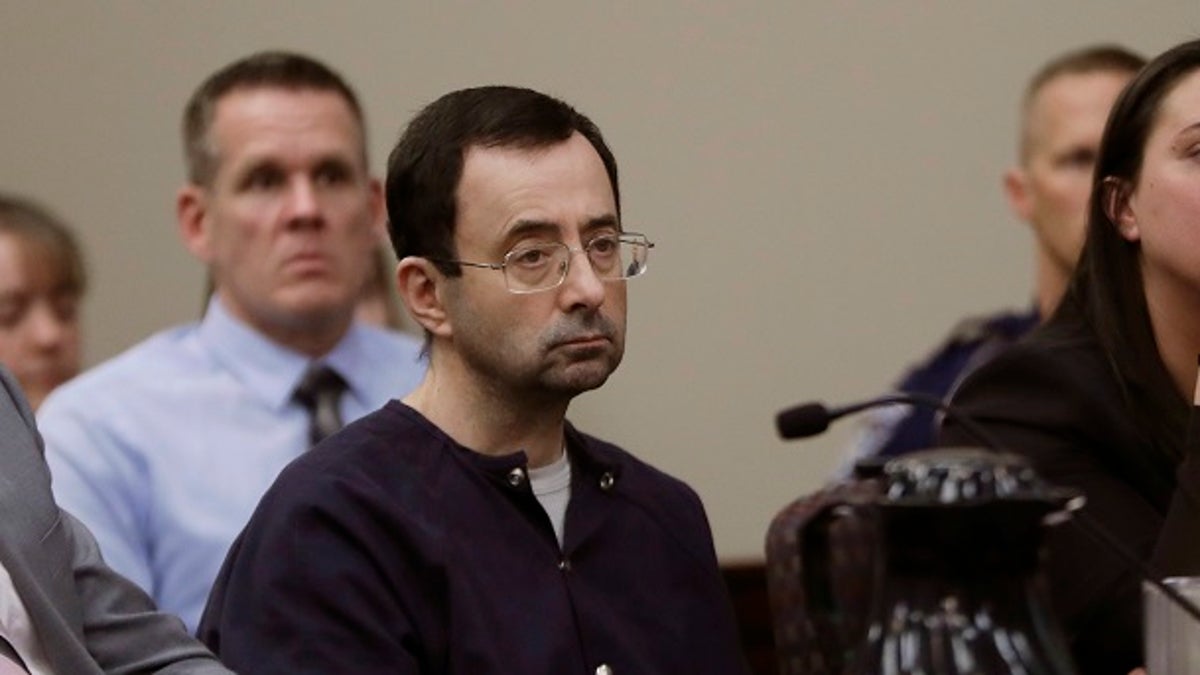 FILE - In this Wednesday, Jan. 24, 2018 file photo, Larry Nassar sits during his sentencing hearing in Lansing, Mich. Nassar, a 54-year-old former doctor for USA Gymnastics and member of Michigan State's sports medicine staff, admitted to molesting athletes while he was supposedly treating them for injuries. Nassar was the U.S. national teamâs doctor from 1995 to 2015. (AP Photo/Carlos Osorio, File)