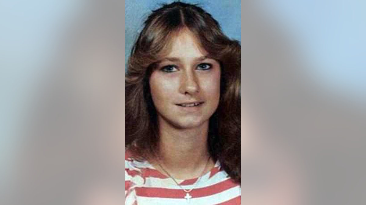 A portrait of Laura Miller in a striped shirt from the 1980s