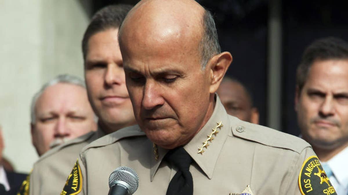 Former Los Angeles Sheriff Lee Baca has agreed to plead guilty to lying to investigators during a federal corruption probe that tainted his career, federal prosecutors said Wednesday.    Baca resigned from the helm of the nation's largest sheriff's department in 2014 amid the probe that led to charges against underlings for beating inmates and for trying to thwart an FBI investigation into those beatings.    U.S. Attorney Eileen Decker scheduled an afternoon news conference to announce that Baca had agreed to plead guilty to a charge of lying to federal investigators during the civil rights investigation.    Baca, who ran the department for more than 15 years, has said previously that he wasn't aware of abuses at the jail or efforts by underlings to stifle the FBI probe by hiding an inmate informant.    With his guilty plea, Baca would be the 18th former member of the department convicted in the case, according to U.S attorney's spokesman Thom Mrozek.    Baca avoided charges for years as prosecutors moved up the ranks to indict a number of officers and, eventually, his second-in-command.    In May, when former Undersheriff Paul Tanaka and another high-ranking member of the department were charged with obstructing justice, prosecutors declined to comment on whether Baca was under investigation.    Tanaka is facing trial, but his co-defendant, former Capt. Tom Carey, pleaded guilty and agreed to testify in related court proceedings. It's not clear if that included providing grand jury testimony against Baca.    Members of the department have been convicted of federal crimes, including beating inmates, obstructing justice, bribery and conspiracy. The convictions stem from a grand jury investigation that began in 2010 into allegations of abuse and corruption at the downtown Men's Central Jail.    Deputies tried to hide an FBI jail informant from his handlers for two weeks in 2011 by shifting him from cell to cell at various jails under different names and altering jail computer records. The FBI wanted the informant to testify to a grand jury.    Tanaka retired from the department in 2013 and ran unsuccessfully to replace his former boss, losing by a wide margin to Jim McDonnell.