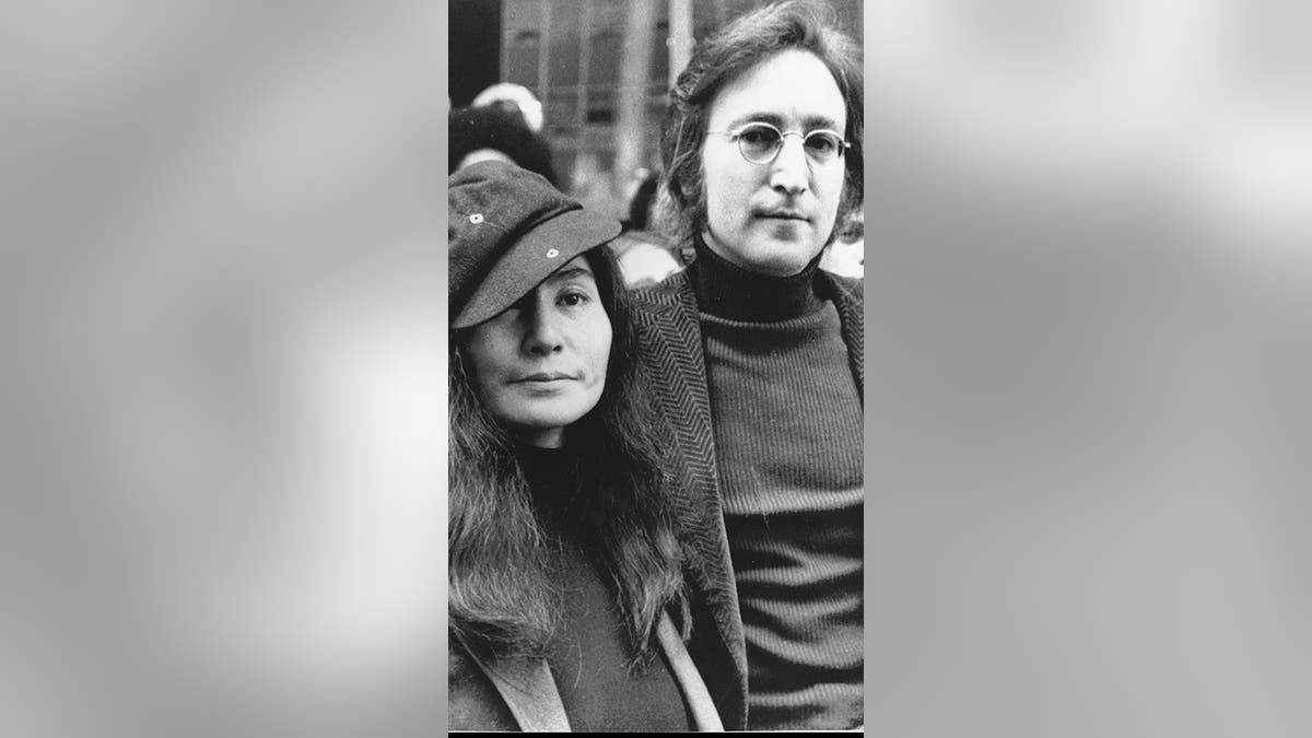 FILE - In this file photo dated April 18, 1972, John Lennon, right, and Yoko Ono, left, are seen outside the U.S. Immigration offices in New York City, USA. German police said Monday, Nov. 20, 2017 they have arrested a man suspected of handling stolen objects from the estate of John Lennon, including diaries which were stolen from Lennonâs widow, Yoko Ono, in New York in 2006. (AP Photo, File)