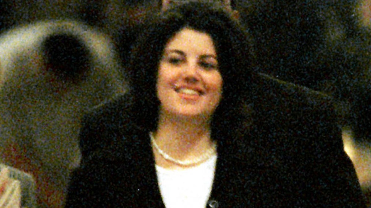 Monica Lewinsky, (R), returns from breakfast down the main corridor of the Mayflower Hotel in Washington, January 24. Lewinsky met with the House prosecutors January 24 after she was ordered to answer more questions about her affair with [President Clinton by U.S. District Judge Norma Holloway Johnson] on January 23. The House prosecutors said later January 24 that they had a 
