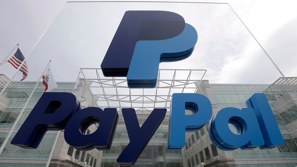 FILE - This March 10, 2015, file photo, shows signage outside PayPal's headquarters in San Jose, Calif. PayPal said on Tuesday, April 5, 2016,  it's canceling plans to bring 400 jobs to North Carolina after lawmakers passed a law that restricts protections for lesbian, gay, bisexual and transgender people. (AP Photo/Jeff Chiu, File)