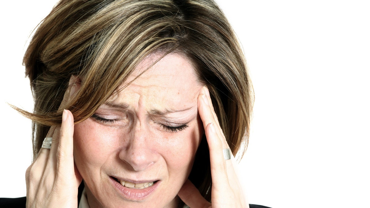 lightheaded woman headache istock medium