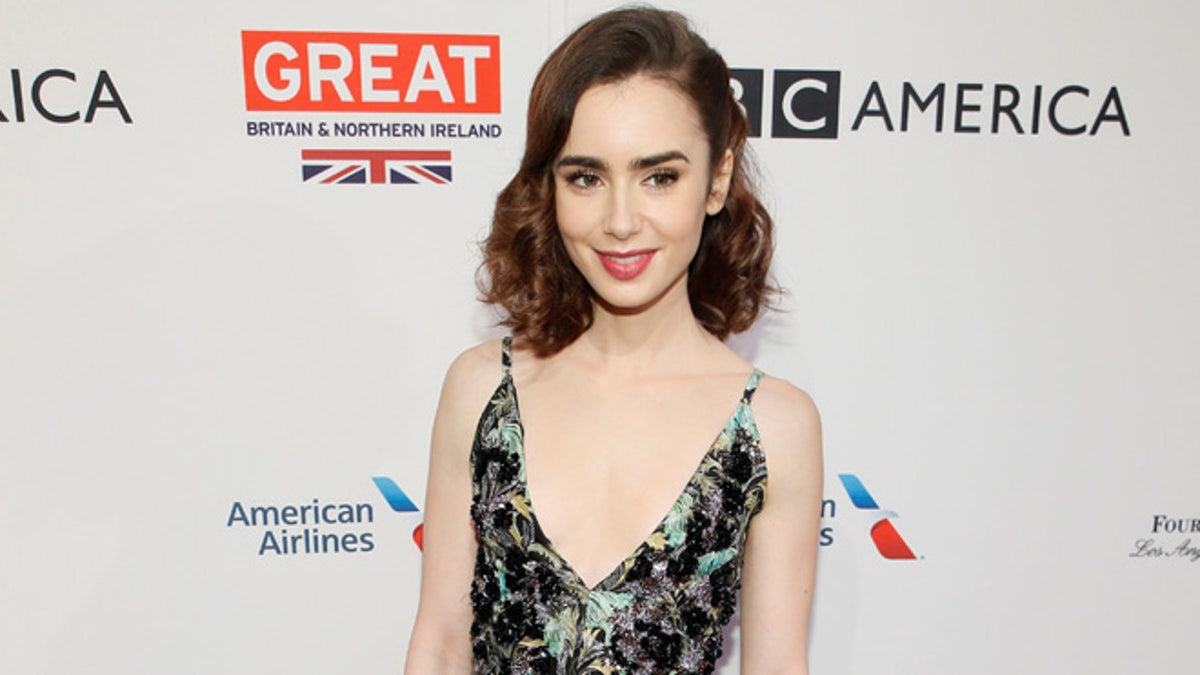 Actor Lily Collins poses at the BAFTA Los Angeles Awards Season Tea Party in Los Angeles, California, January 7, 2017. REUTERS/Danny Moloshok - RTX2XX1S