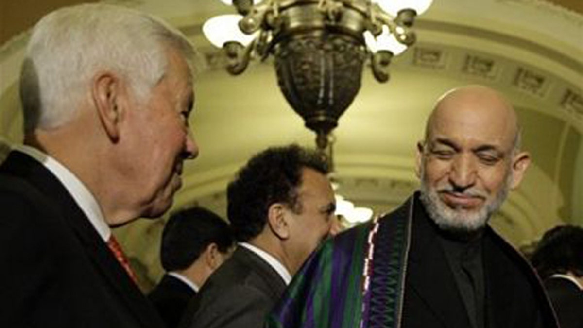 May 7, 2009: Sen. Richard Lugar, ranking Republican on the Senate Foreign Relations Committee, talks with Afghanistan President Hamid Karzai at a news conference on Capitol Hill. (AP Photo)