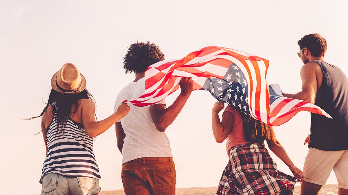 people carrying american flag