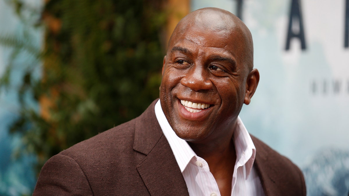 Former NBA basketball player Earvin Magic Johnson poses at the premiere of the movie "The Legend of Tarzan" in Hollywood, California, June 27, 2016. REUTERS/Danny Moloshok - S1AETMKZFGAA