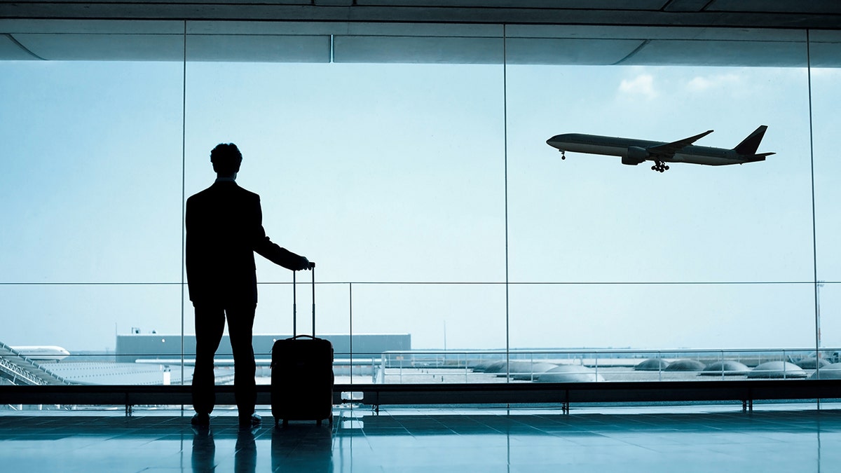 man at airport istock