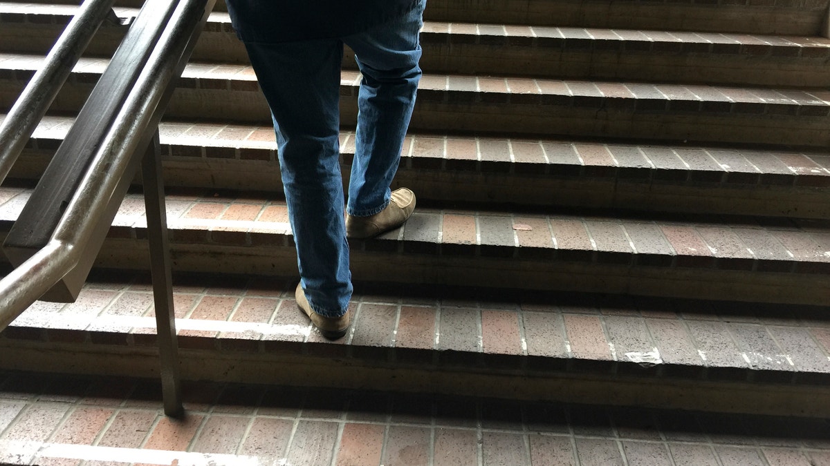 man climbing stairs istock