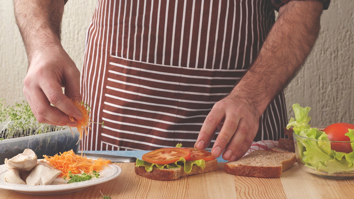 man making sandwich istock large