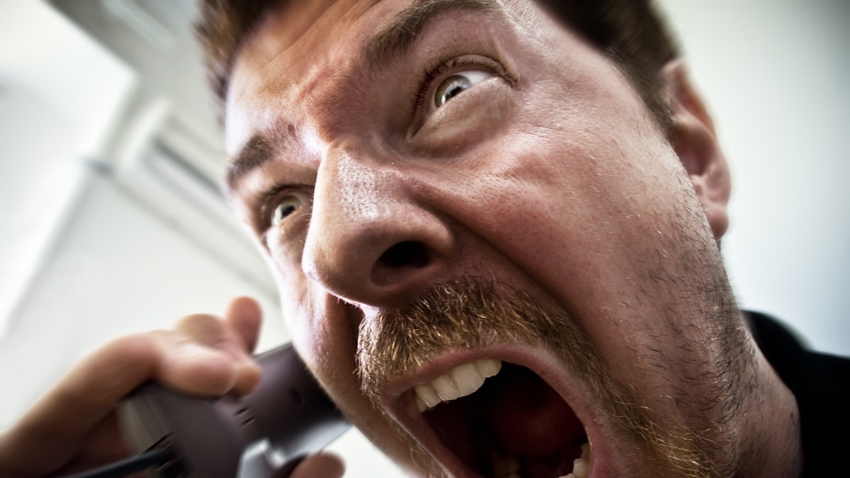 man yelling into phone istock medium
